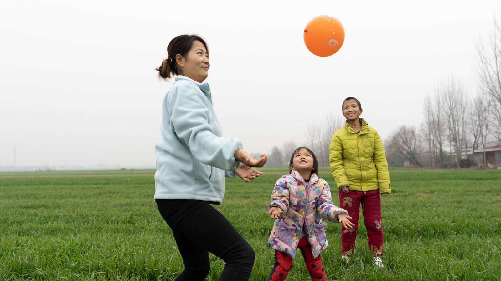 Playing with her teacher and mother